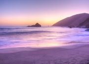 The mystery behind purple sand beaches
